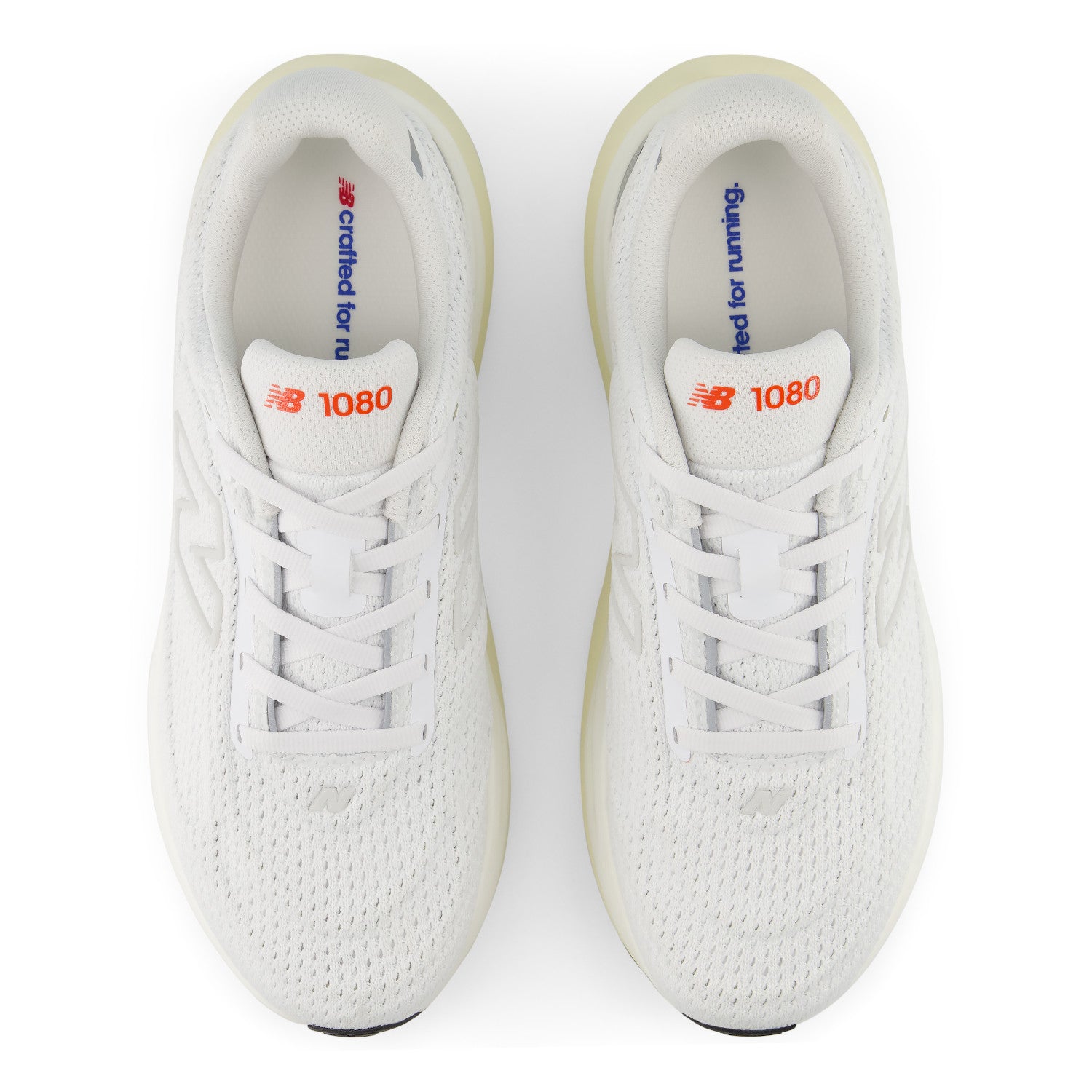 White sneakers with visible branding on a white background
