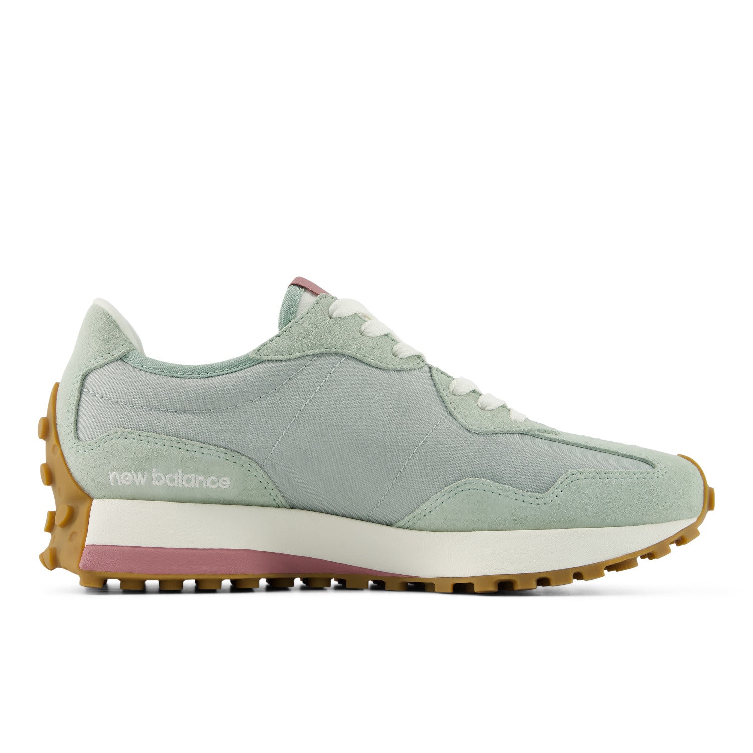 Light green sneaker with brown sole on a white background