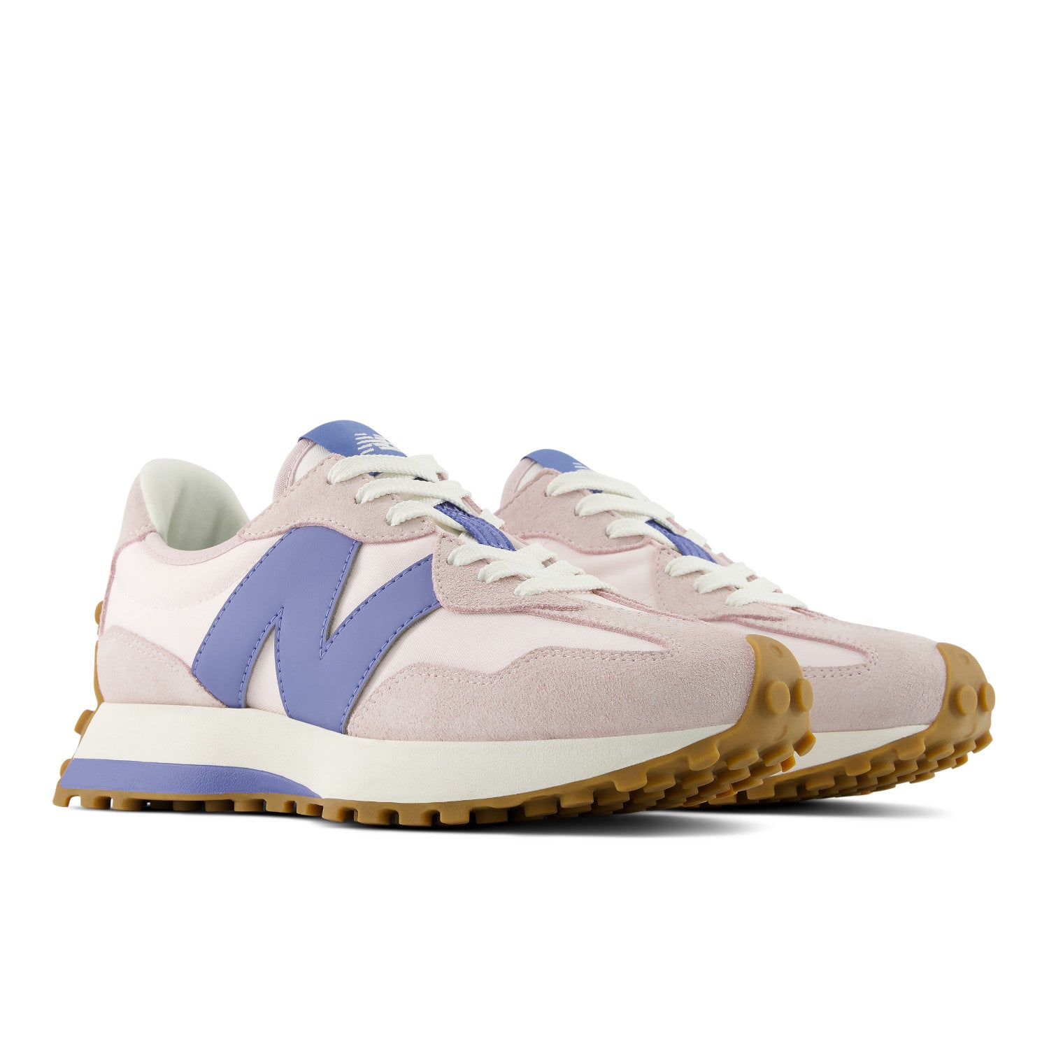 Pair of light pink sneakers with purple accents on a white background