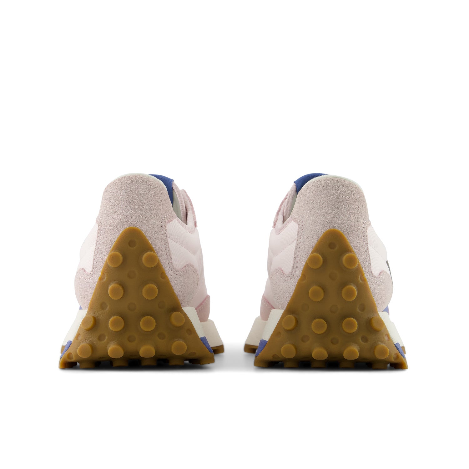 Pair of beige sneakers with brown sole on a white background