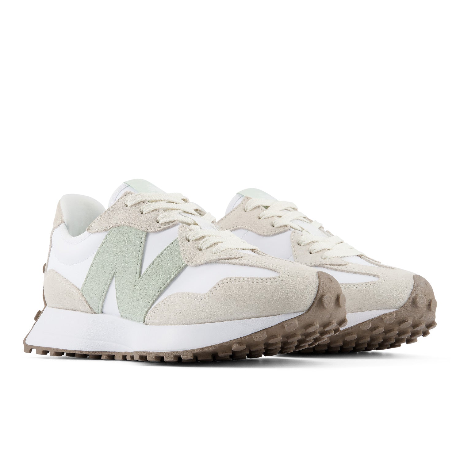 Pair of beige and white sneakers on a white background