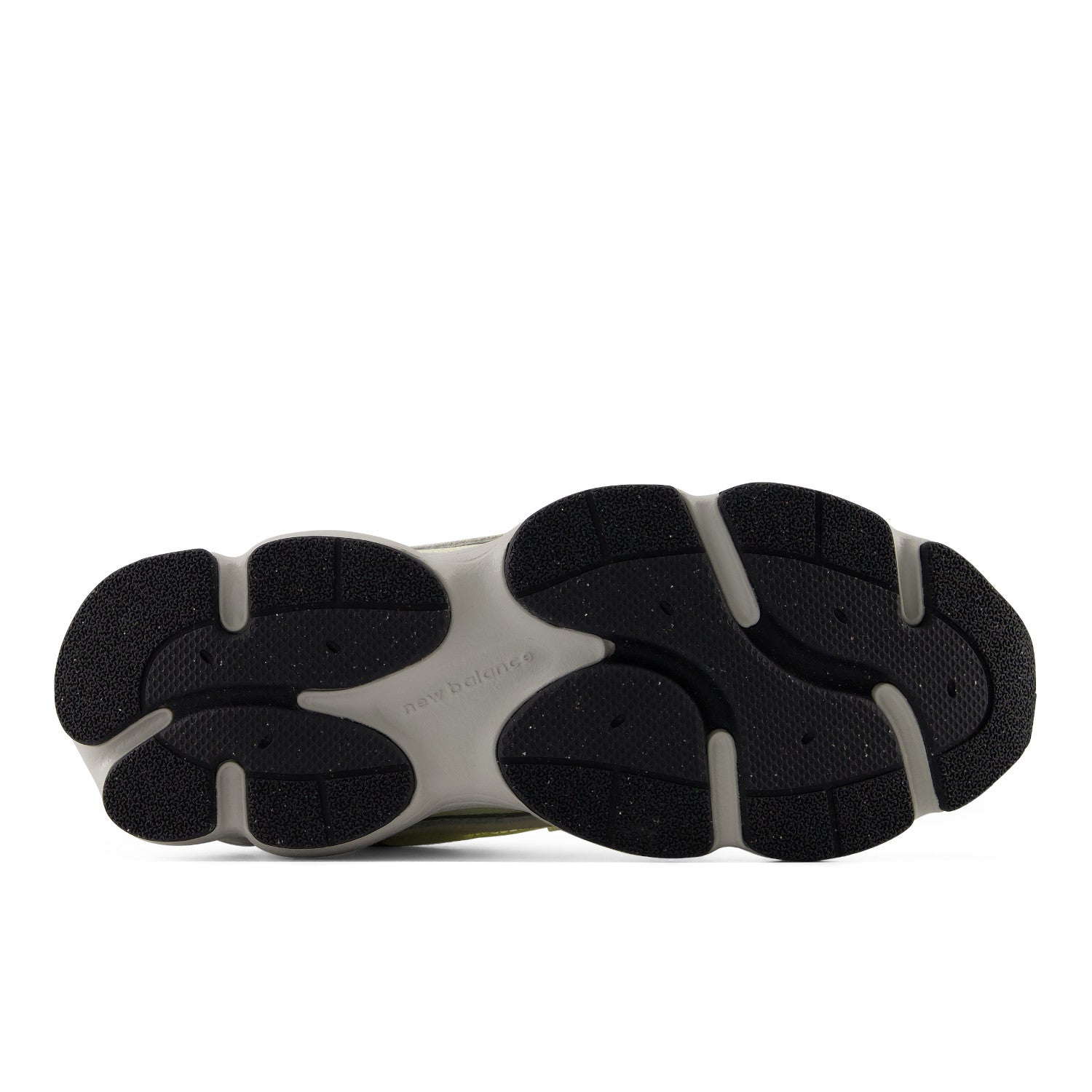 Close-up of a shoe sole with black and gray rubber sole on a white background