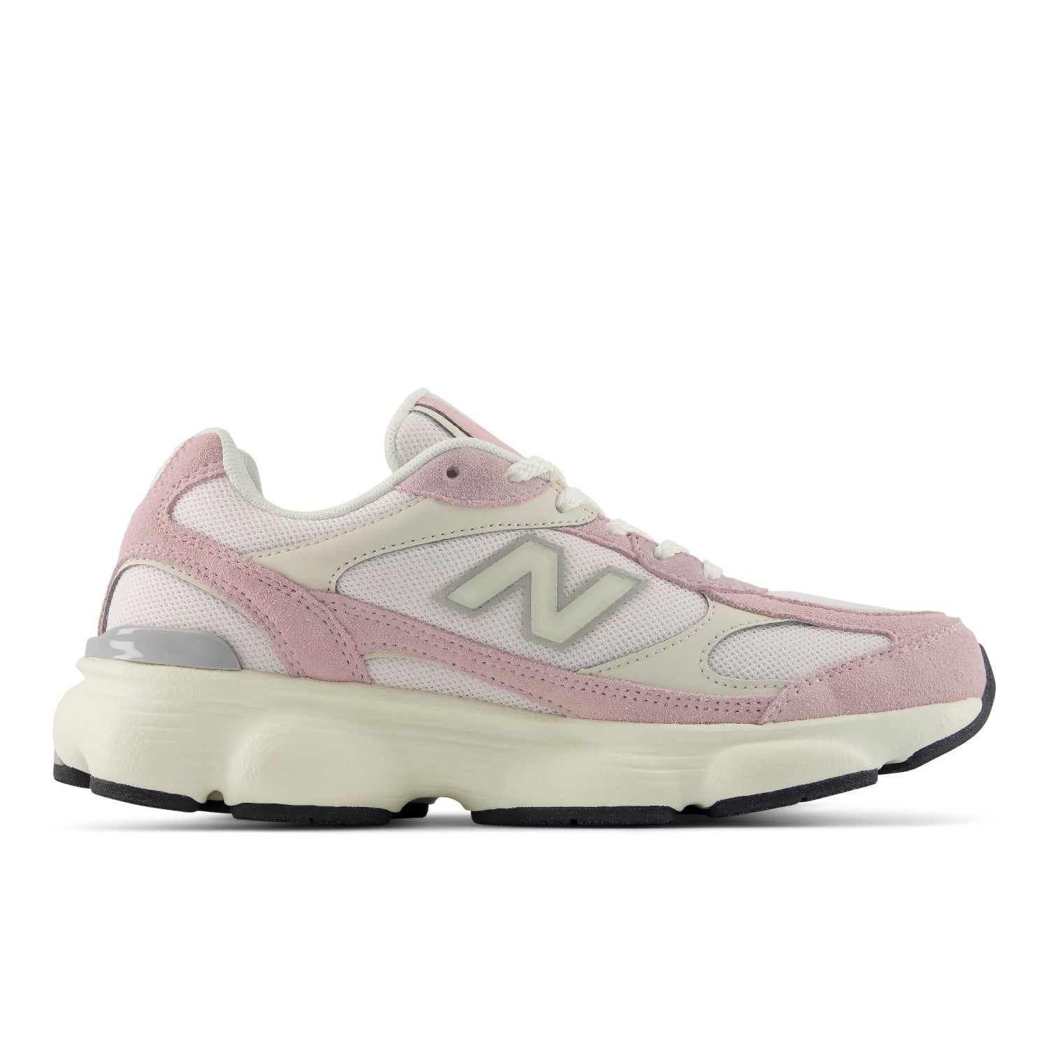 A New Balance sneaker in light pink and cream, featuring a chunky cream midsole and the signature 'N' logo on the side, shown against a plain white background.