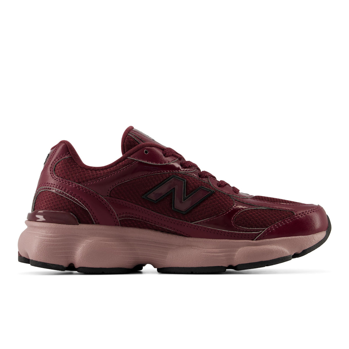 A New Balance running shoe in burgundy and dusty pink, shown from a side profile view against a white background.