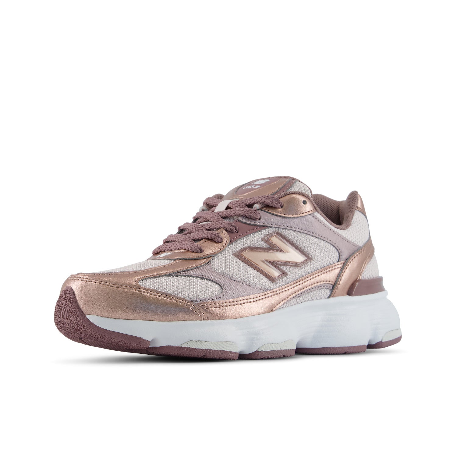 A New Balance sneaker in metallic rose gold and light gray mesh, featuring a chunky white midsole and a metallic rose gold 'N' logo on the side, set against a plain white background.