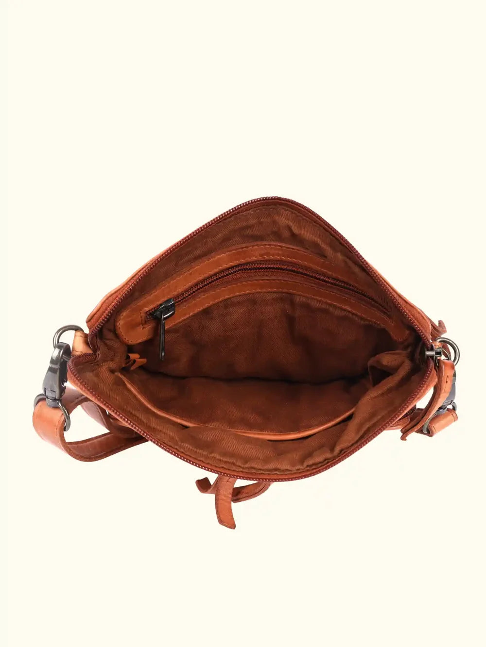 Brown leather handbag with a strap on a white background
