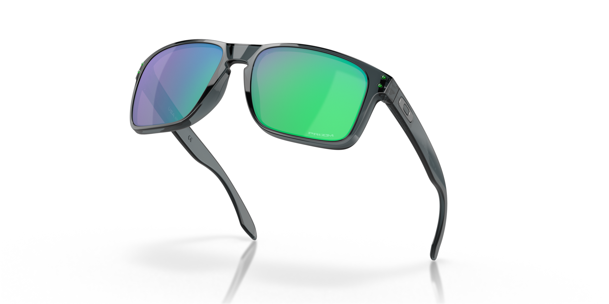 Sunglasses with green and purple lenses on a white background