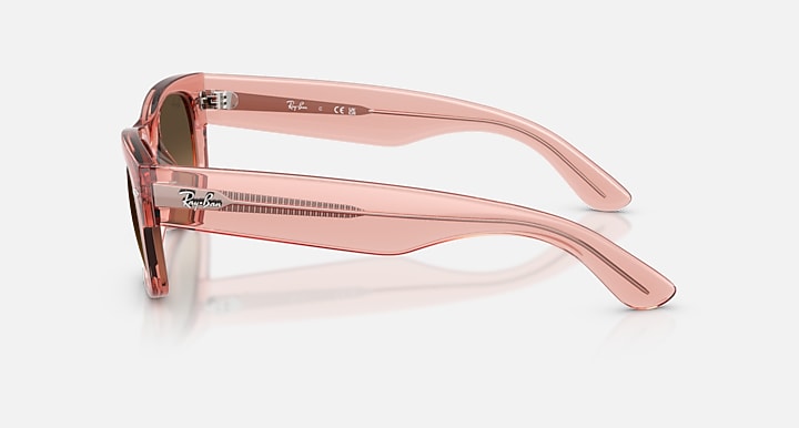 Pink sunglasses with a reflective surface on a white background