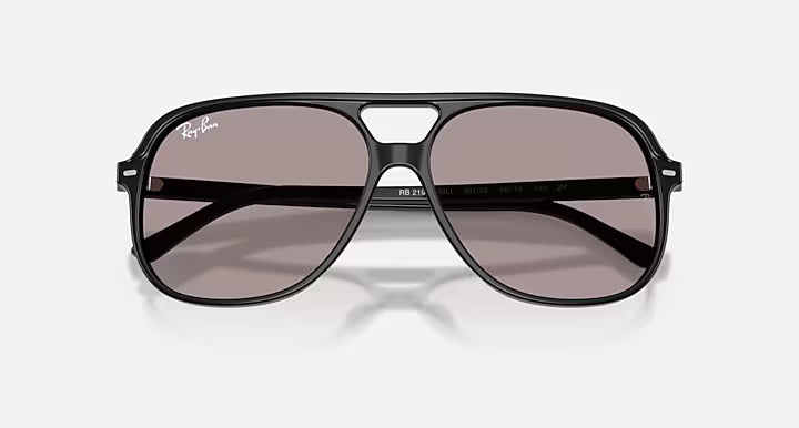 Black aviator sunglasses with gray lenses on a white background