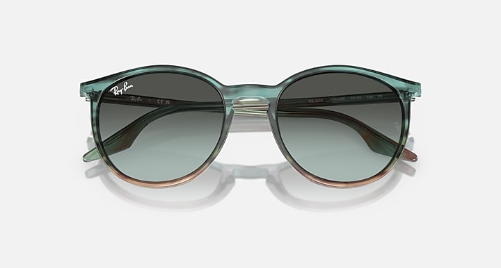 Green sunglasses with a clear frame on a white background