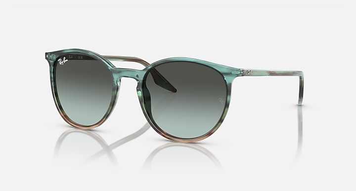 Green sunglasses with gradient lenses on a white background