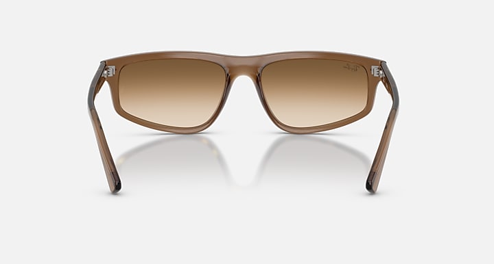 Brown sunglasses with gradient lenses on a white background