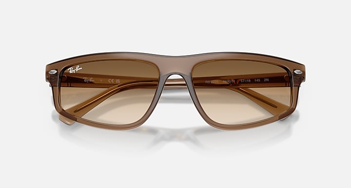 Brown sunglasses with a reflective surface on a white background