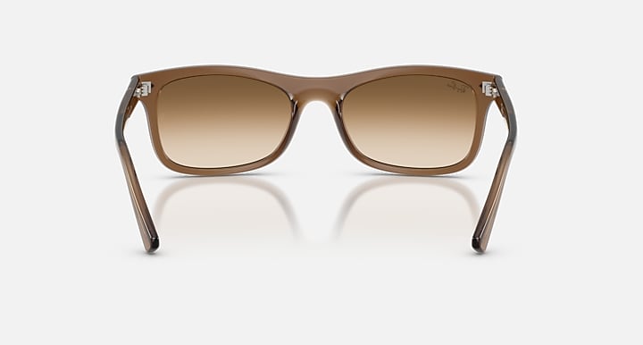 Brown sunglasses with gradient lenses on a white background