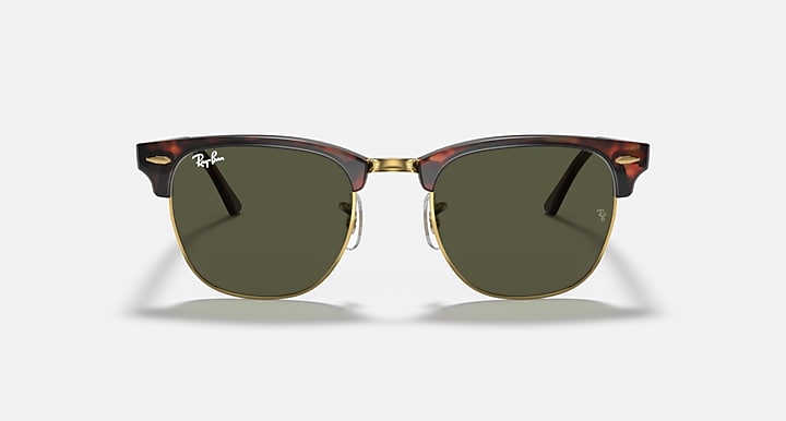 Sunglasses with a distinctive frame design on a white background