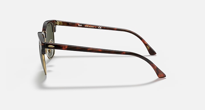 Tortoiseshell sunglasses on a light gray background