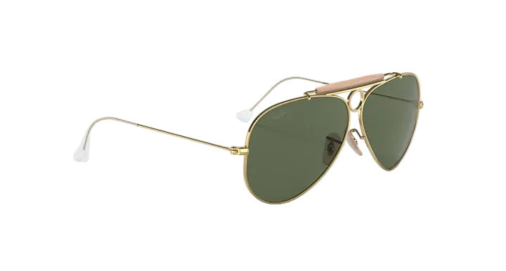 Gold-framed sunglasses with green lenses on a white background