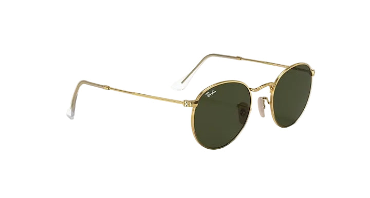 Gold-framed sunglasses with green lenses on a white background