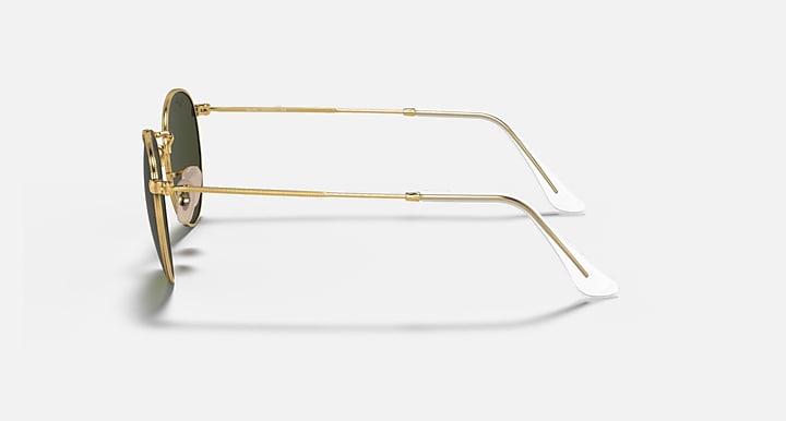 Gold-framed sunglasses on a white background