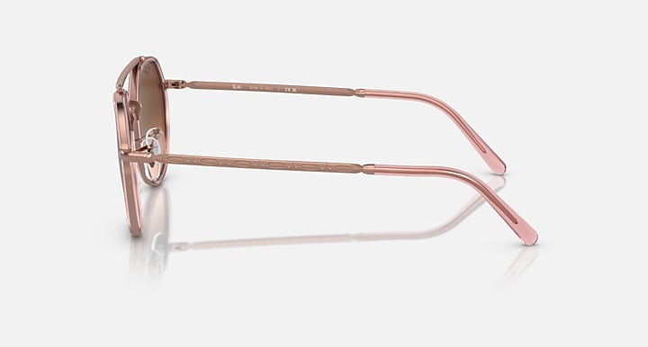 Rose gold sunglasses on a white background
