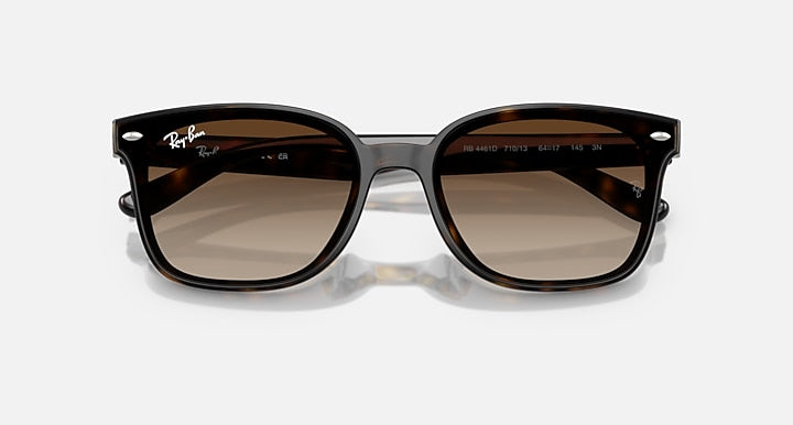 Black sunglasses with brown lenses on a white background