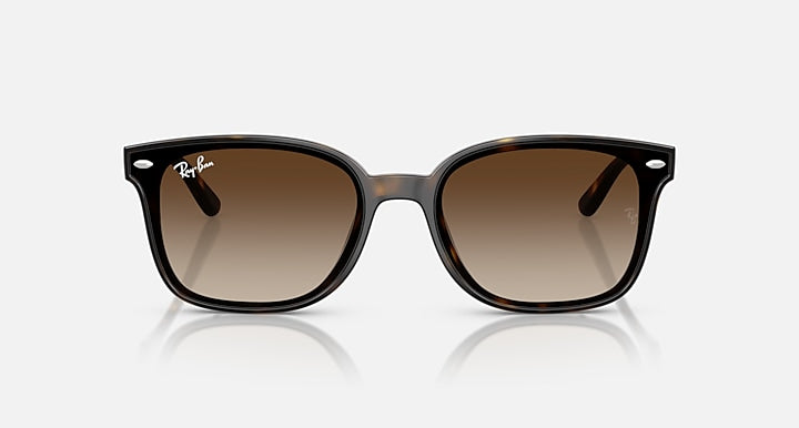 Black sunglasses with gradient lenses on a white background