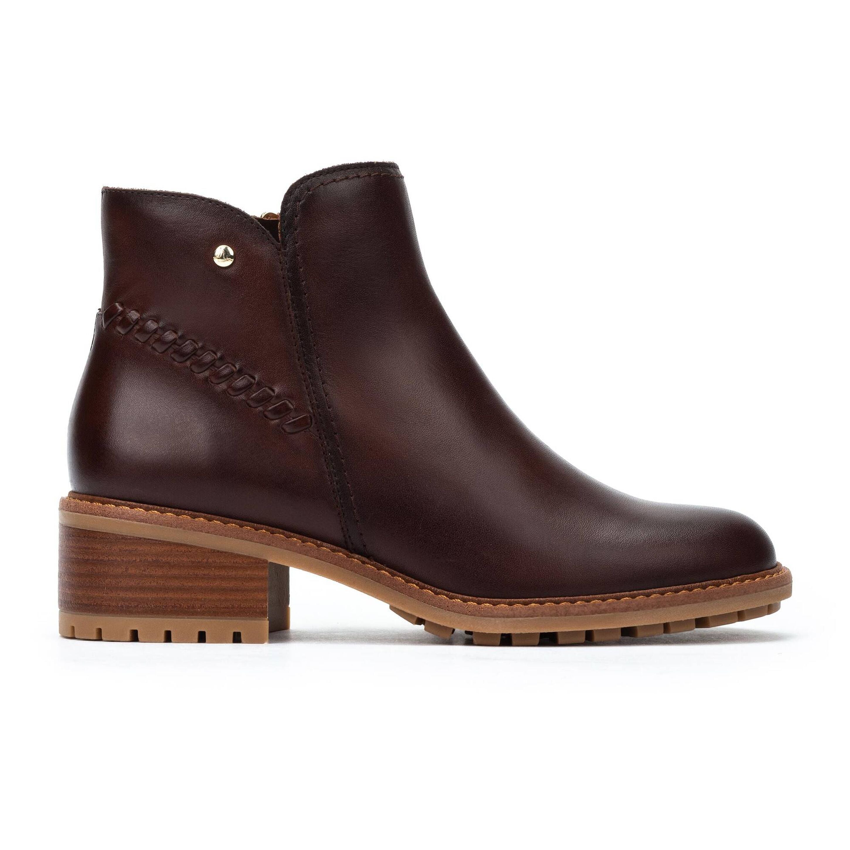 Brown leather ankle boot on a white background