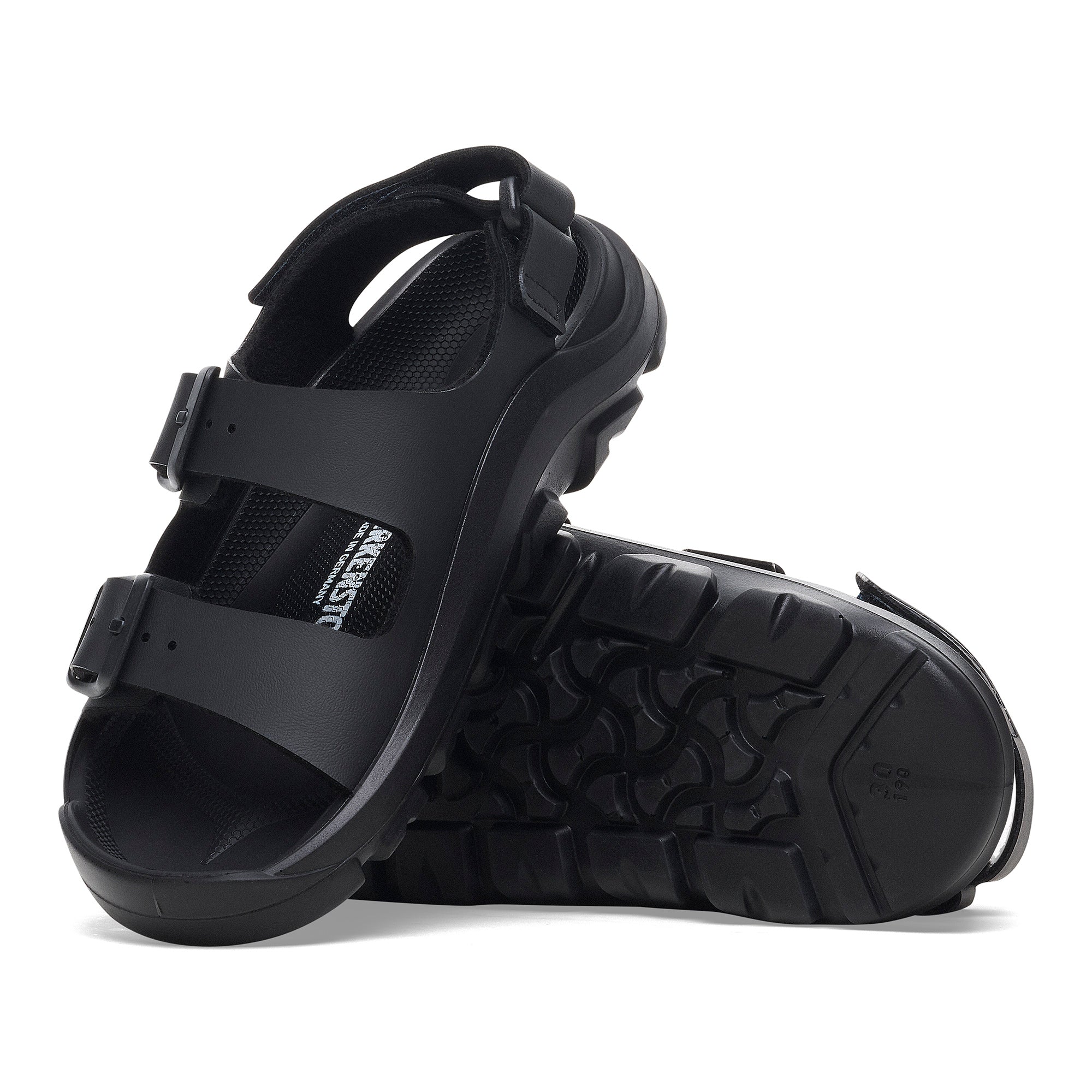 Black sandals with a brand logo on a white background