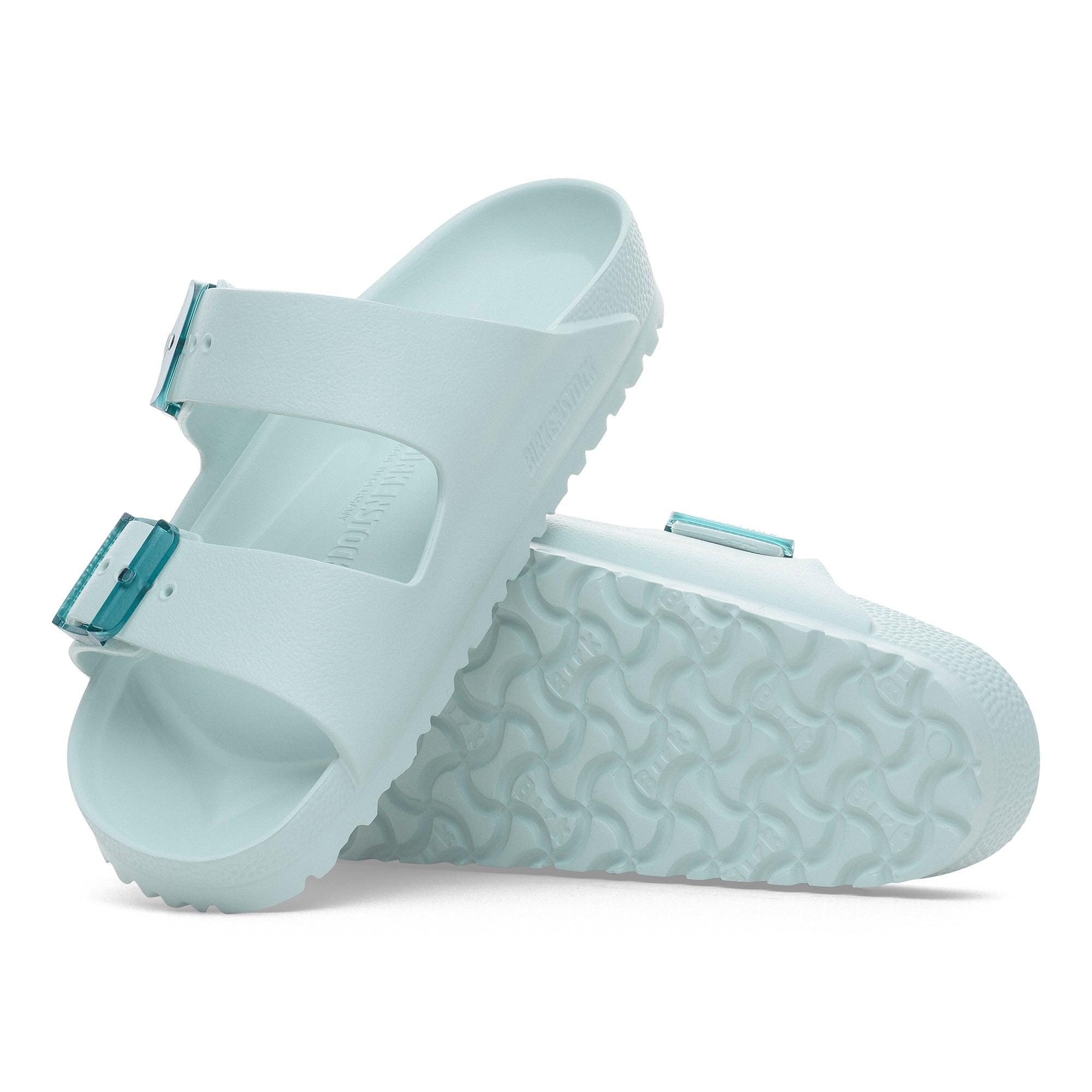 Pair of light blue sandals on a white background