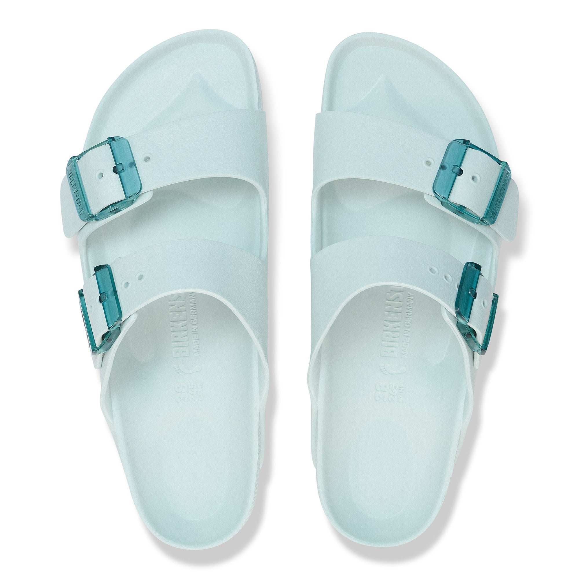 Light blue sandals with buckles on a white background