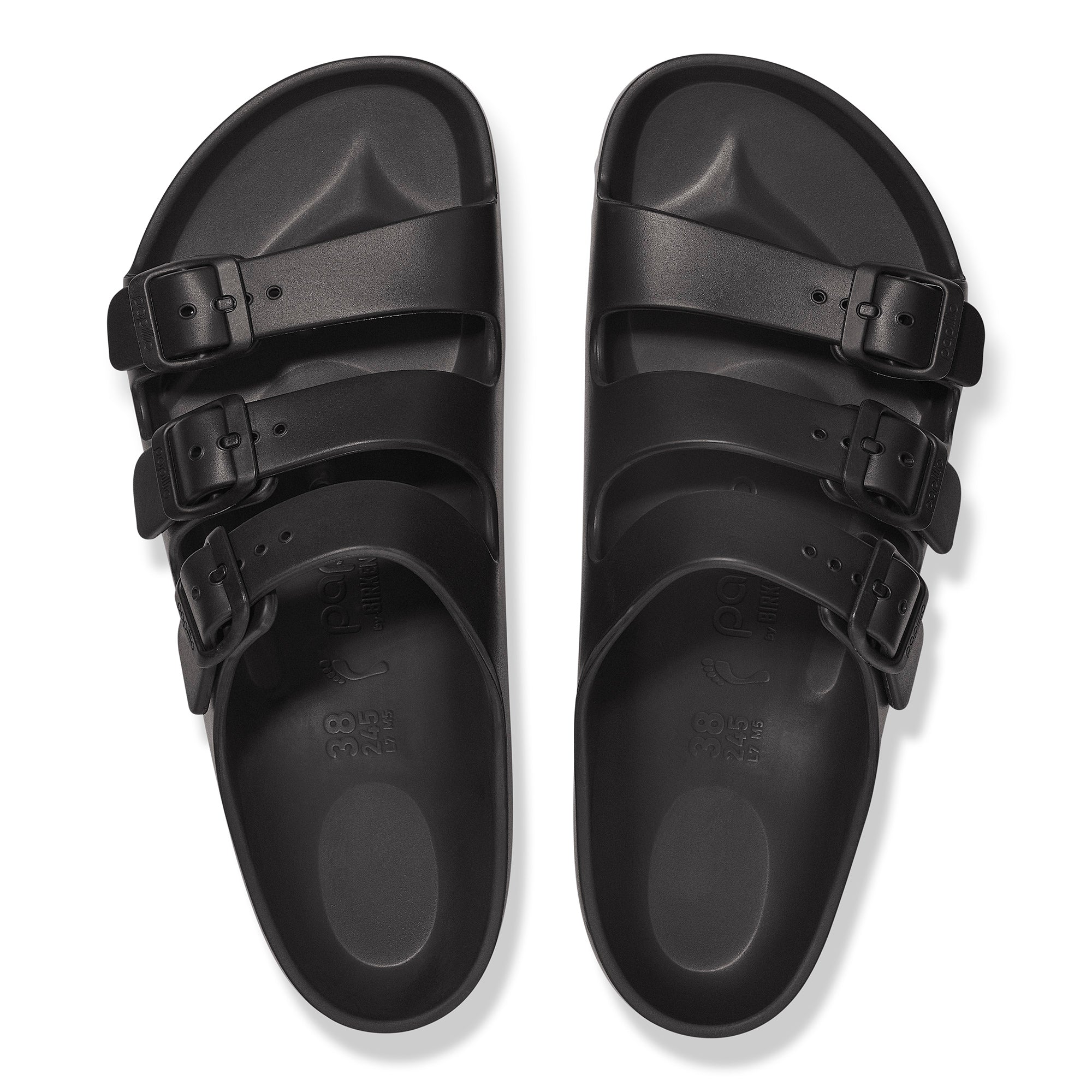 Black sandals with multiple straps on a white background
