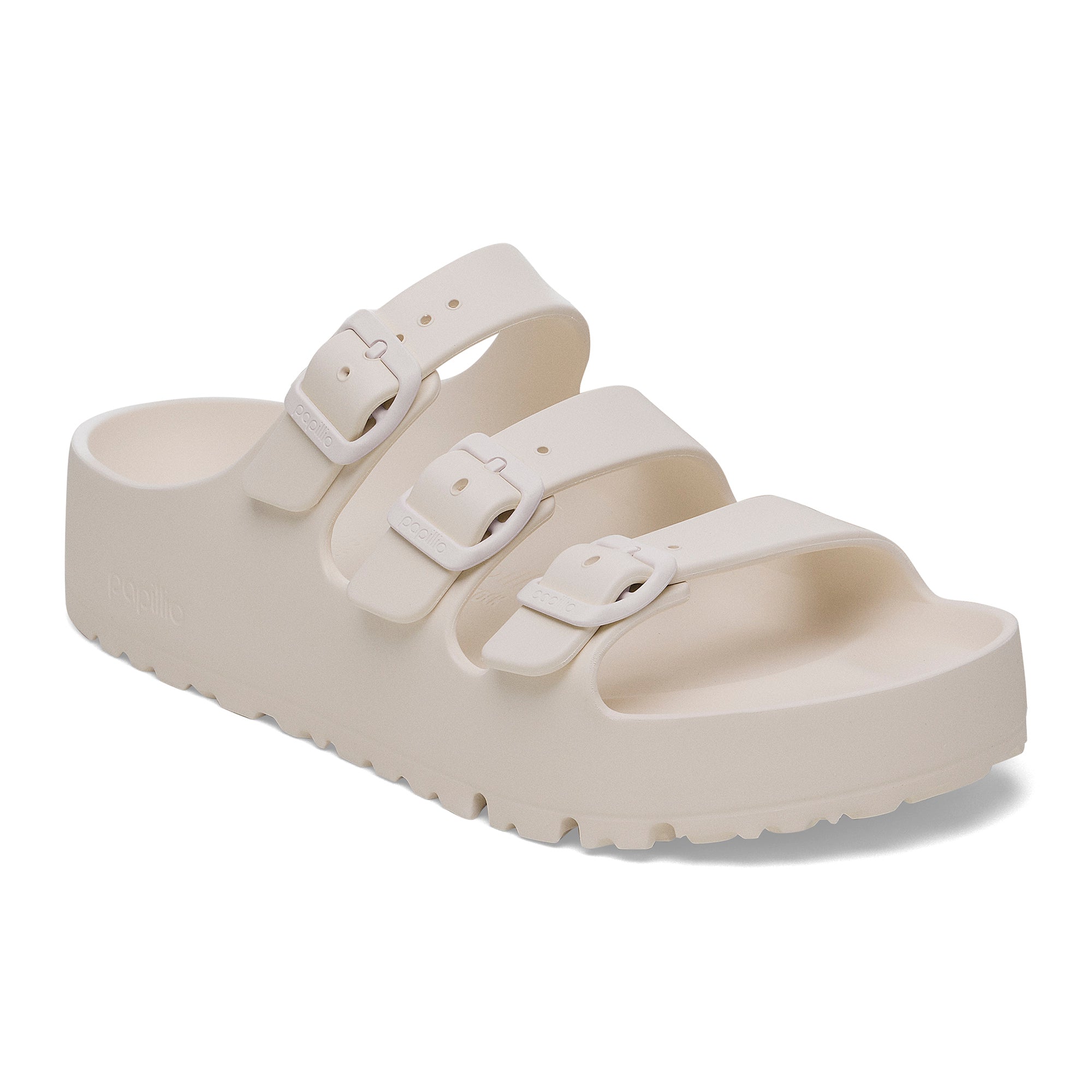 White sandal with two straps on a white background
