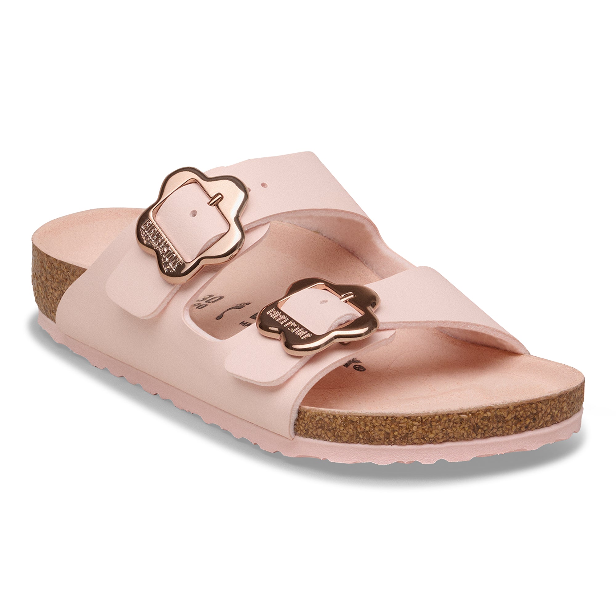 Pink sandal with gold buckle on a white background