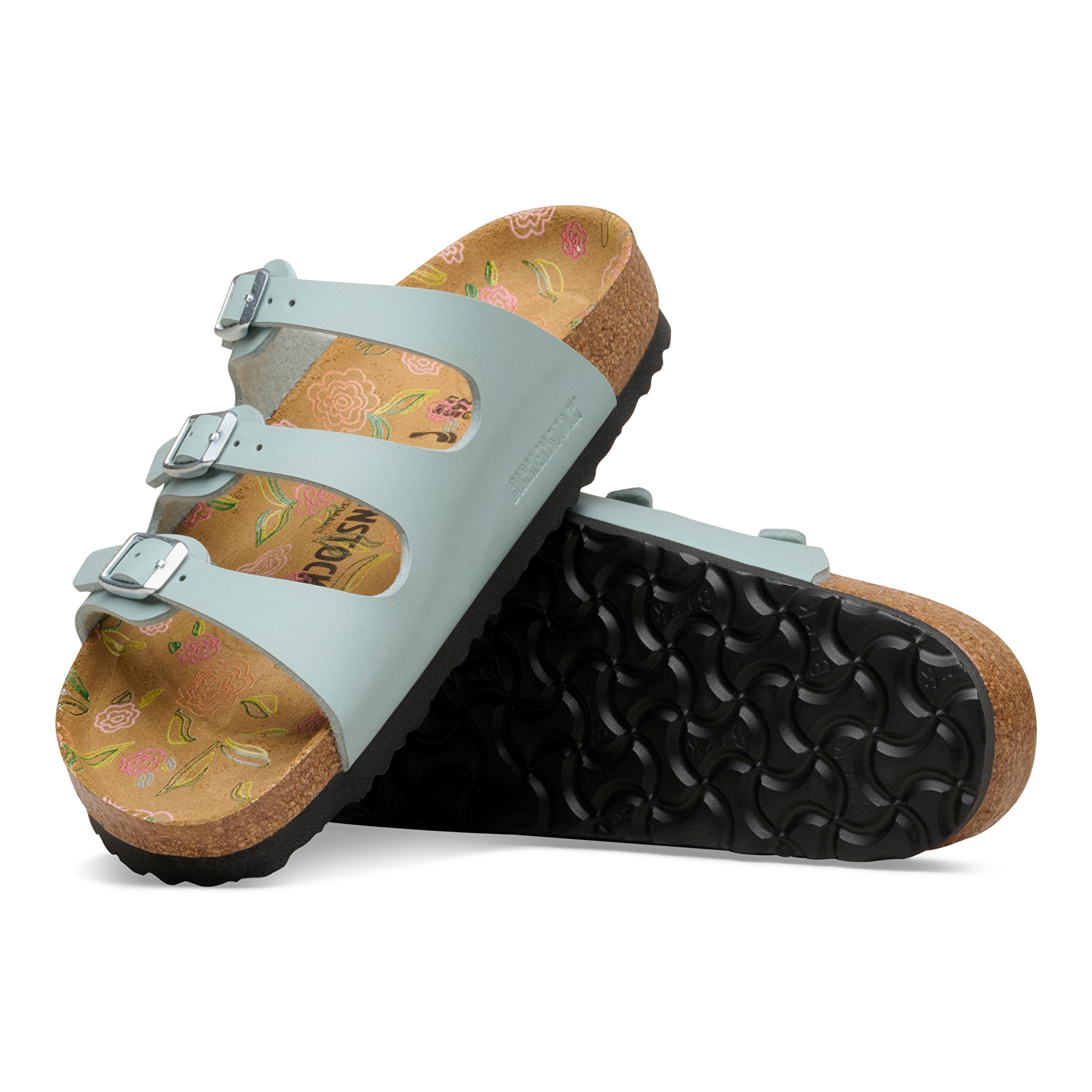 Pair of light blue sandals with floral patterns on a white background