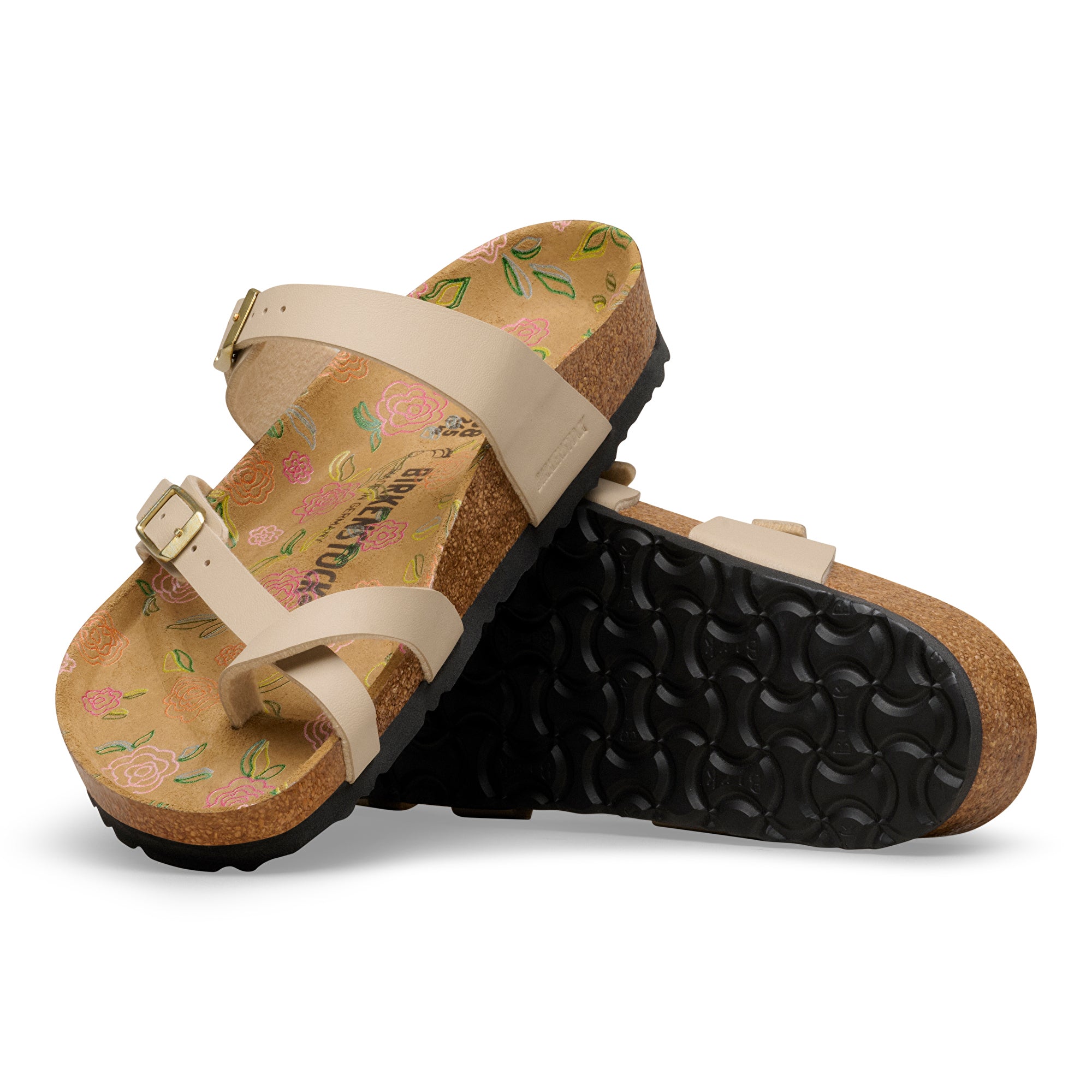 Pair of sandals with floral pattern on a white background