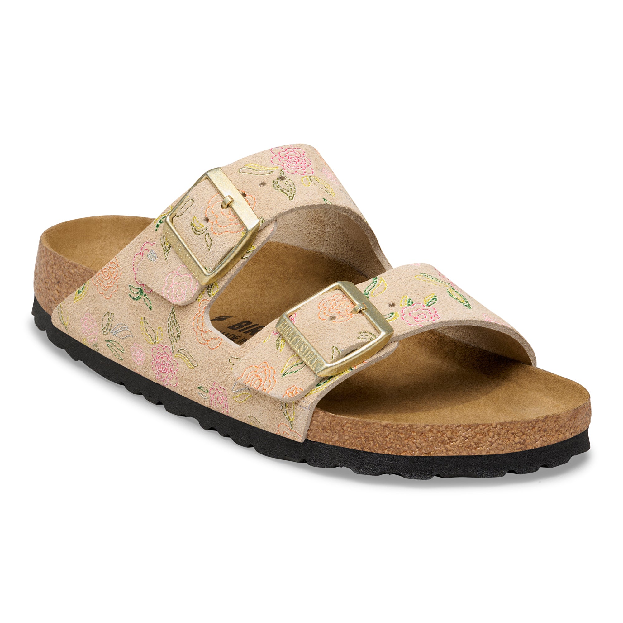 Floral sandal with gold buckles on a white background