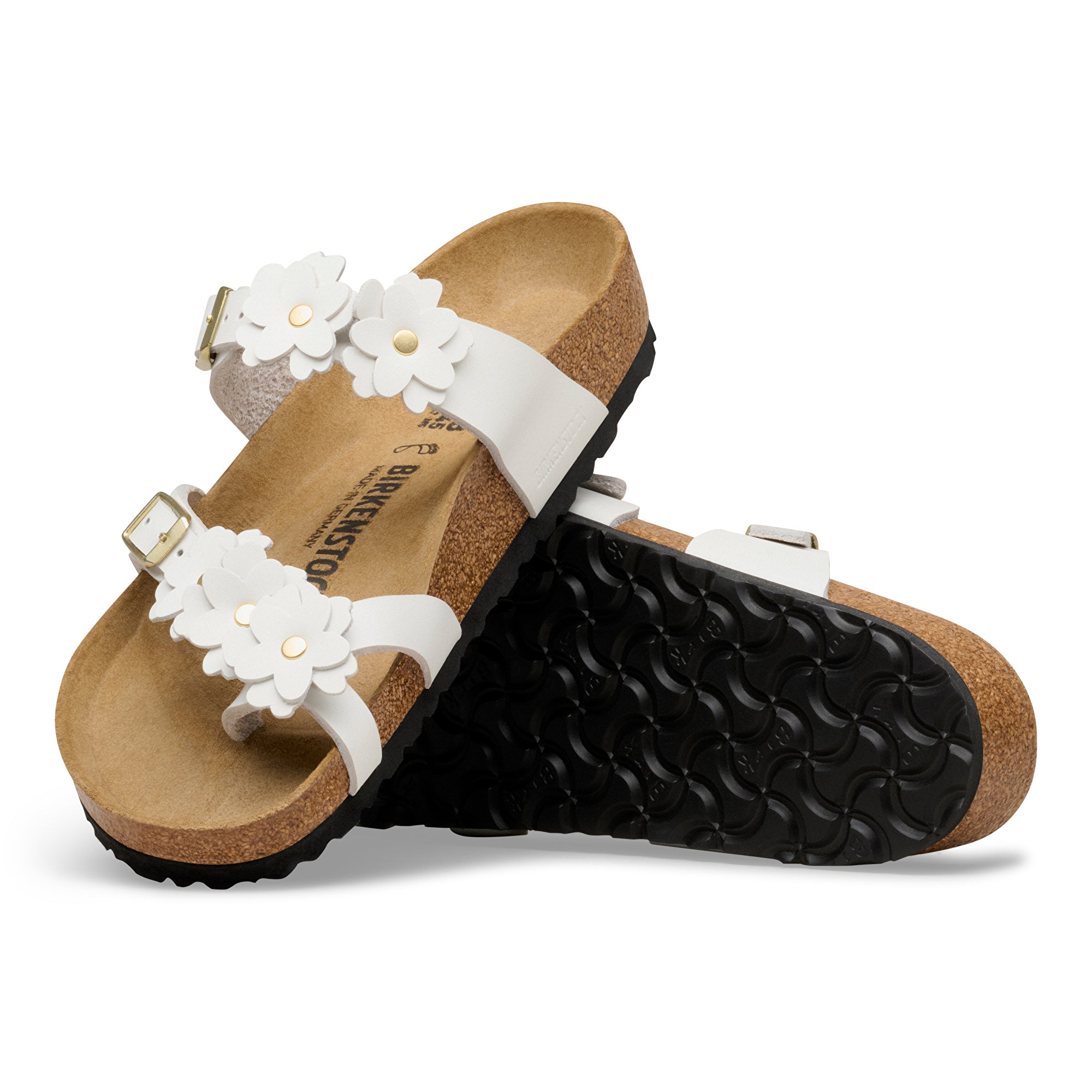Pair of sandals with white flower straps on a white background