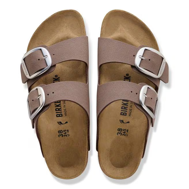 Pair of brown Birkenstock sandals with buckles on a white background