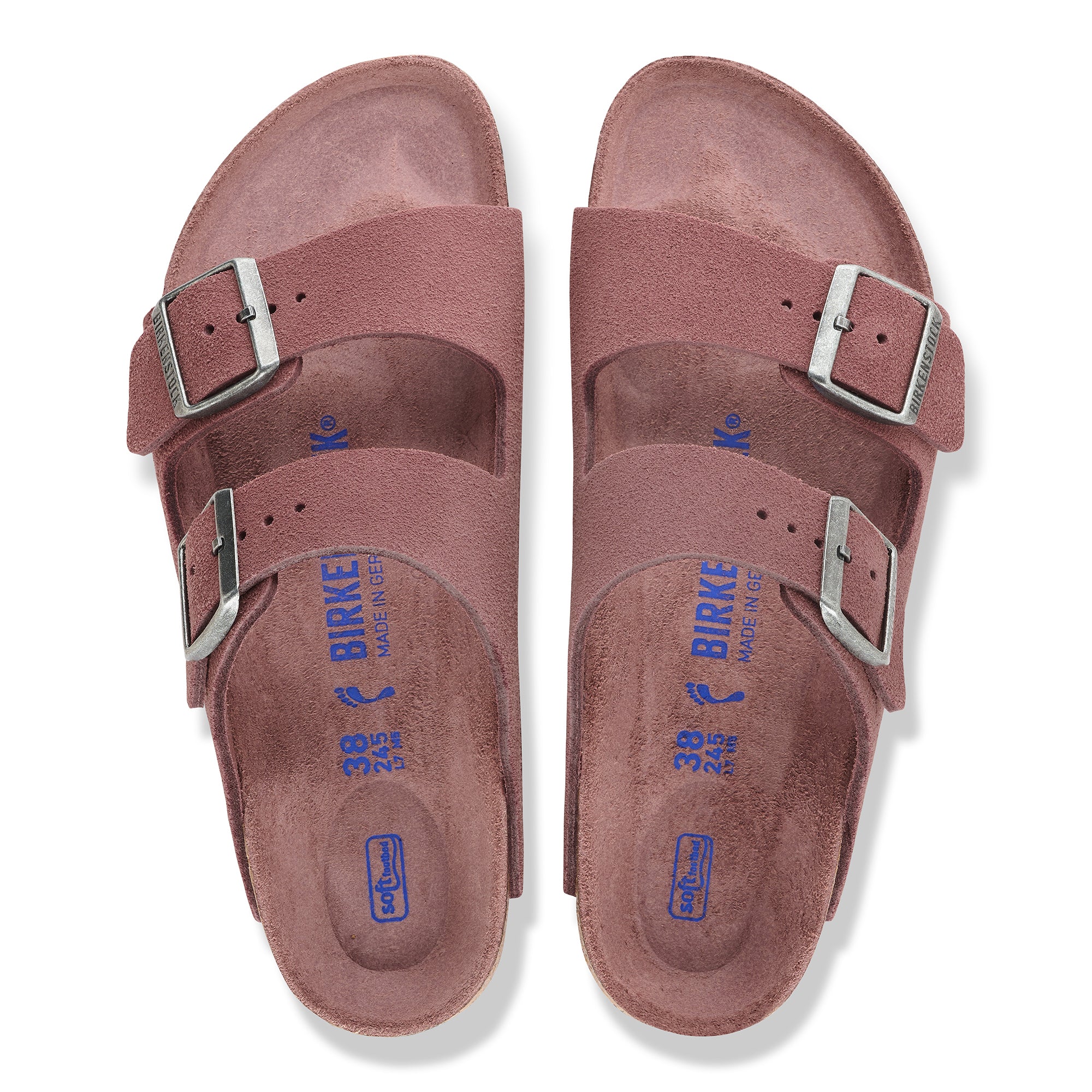 Pair of maroon sandals with silver buckles on a white background