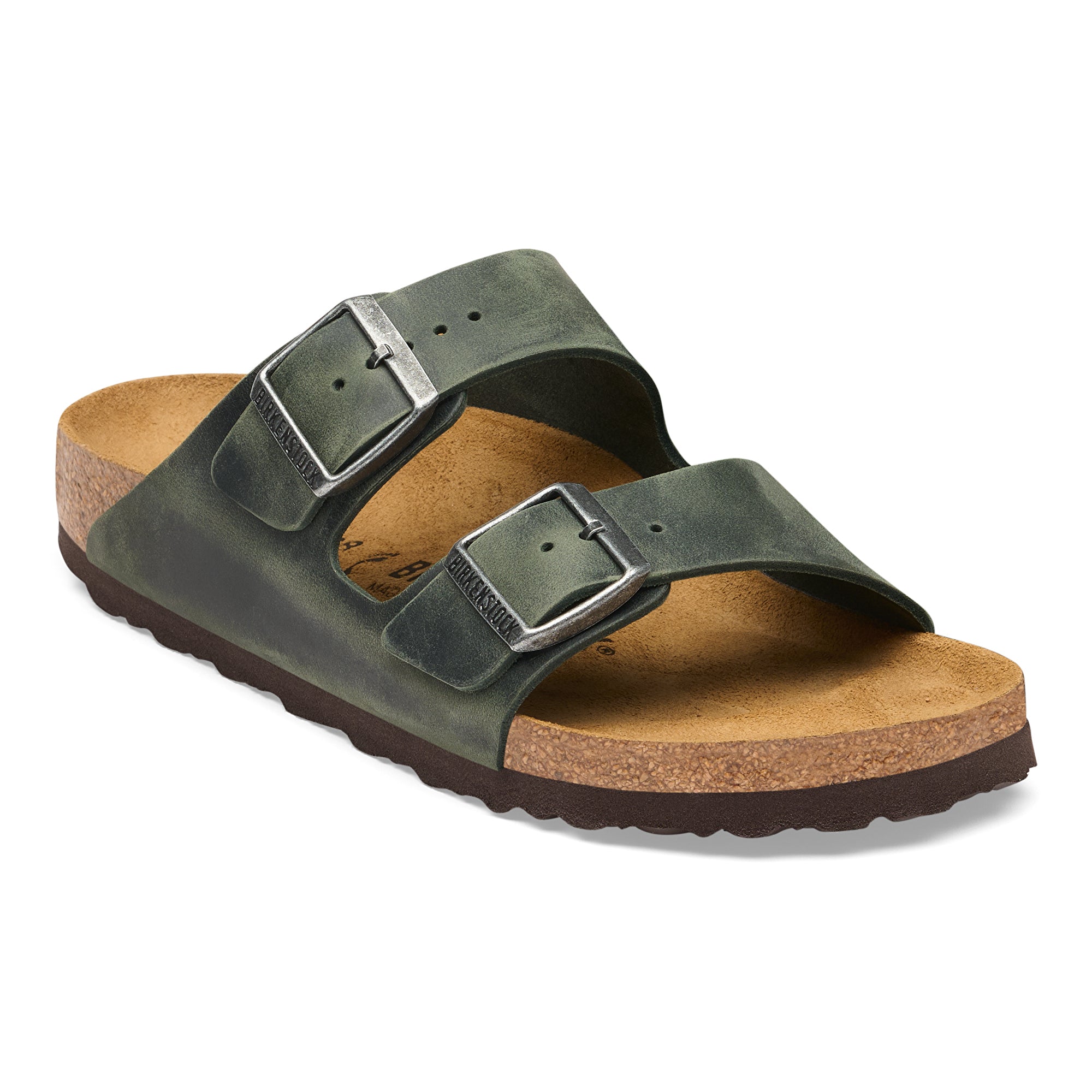 Green sandal with cork sole on a white background