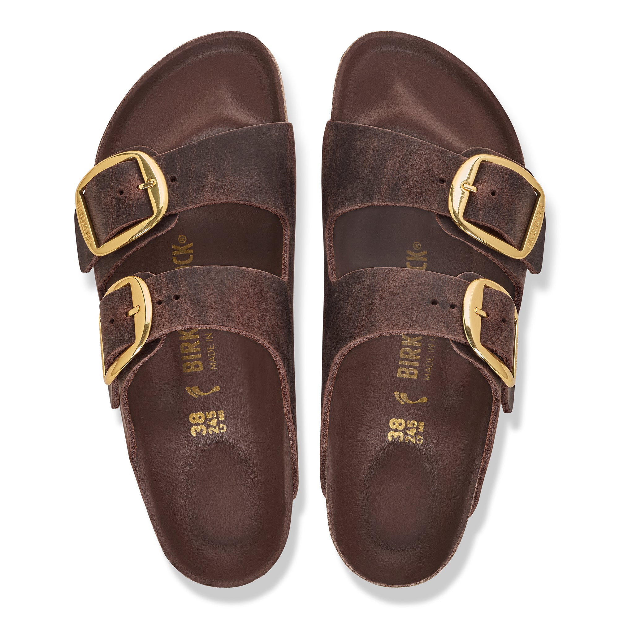Pair of brown Birkenstock sandals with gold buckles on a white background