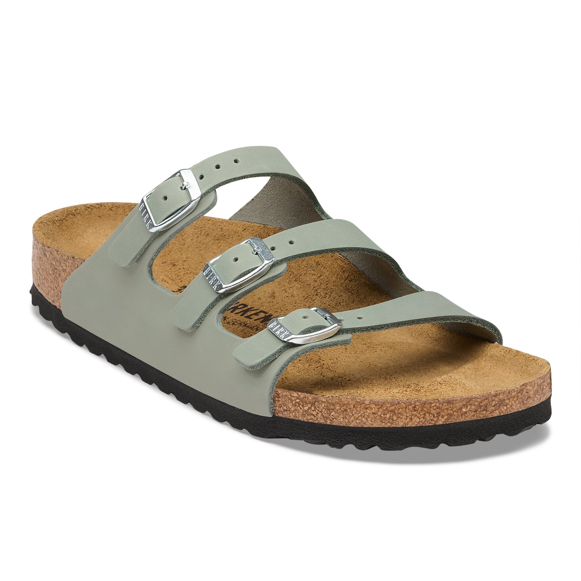 Green sandal with cork sole on a white background