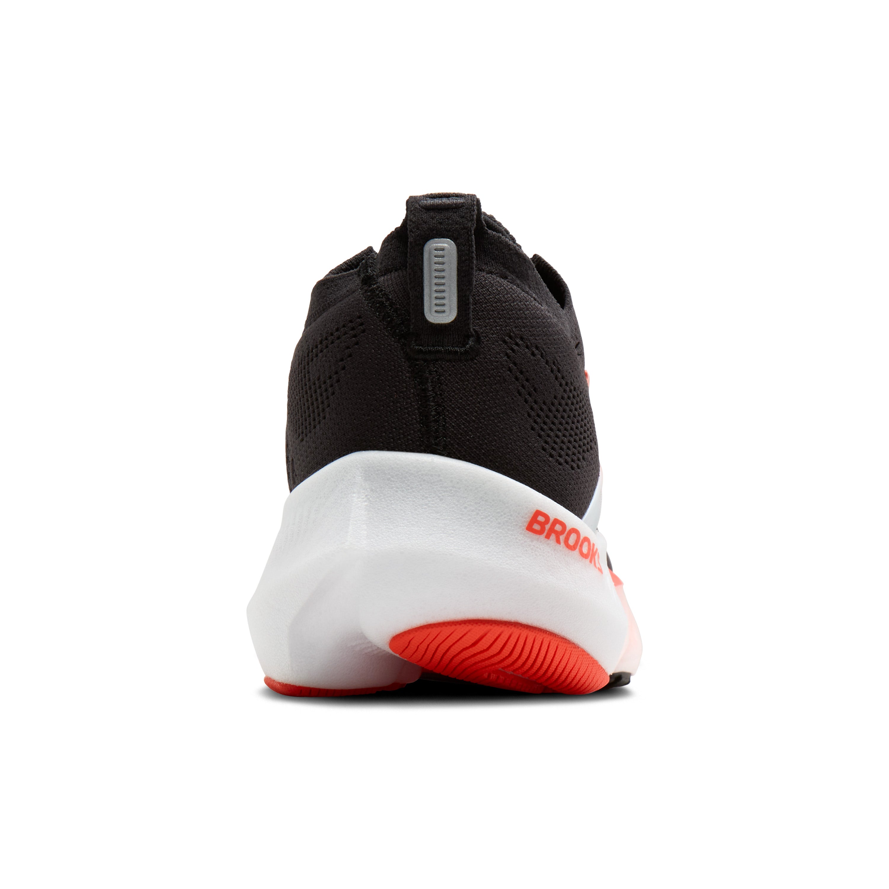 Black and white running shoe with red sole on a white background