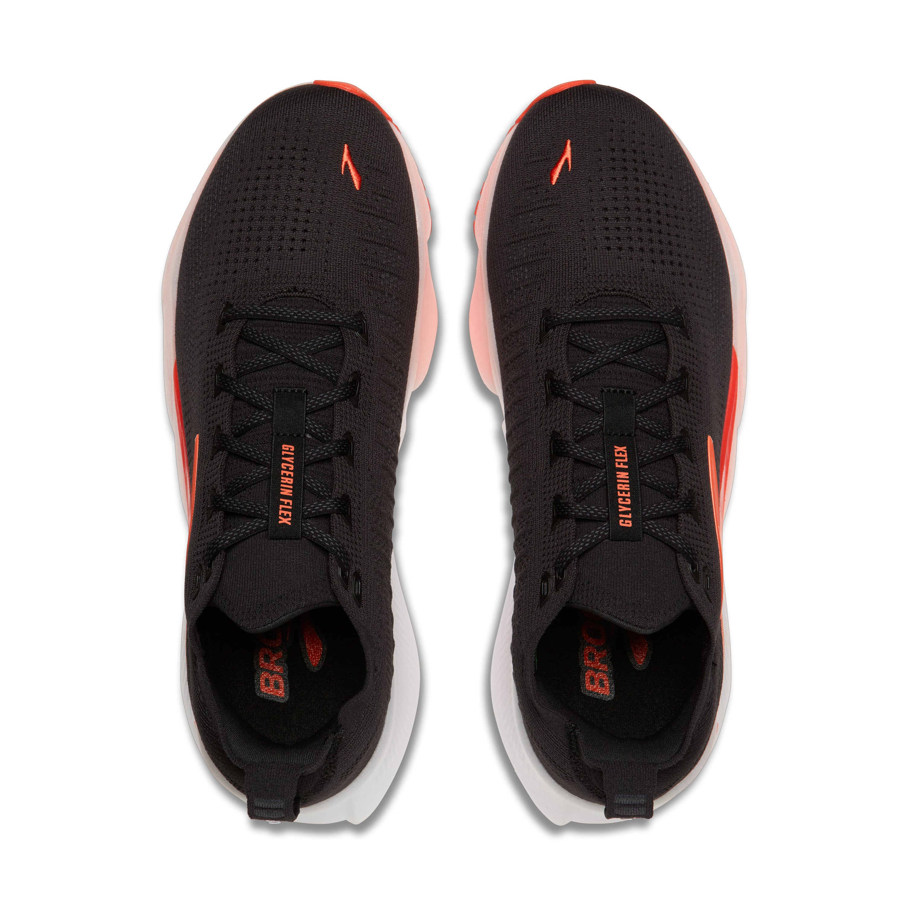 Black running shoes with orange accents on a white background
