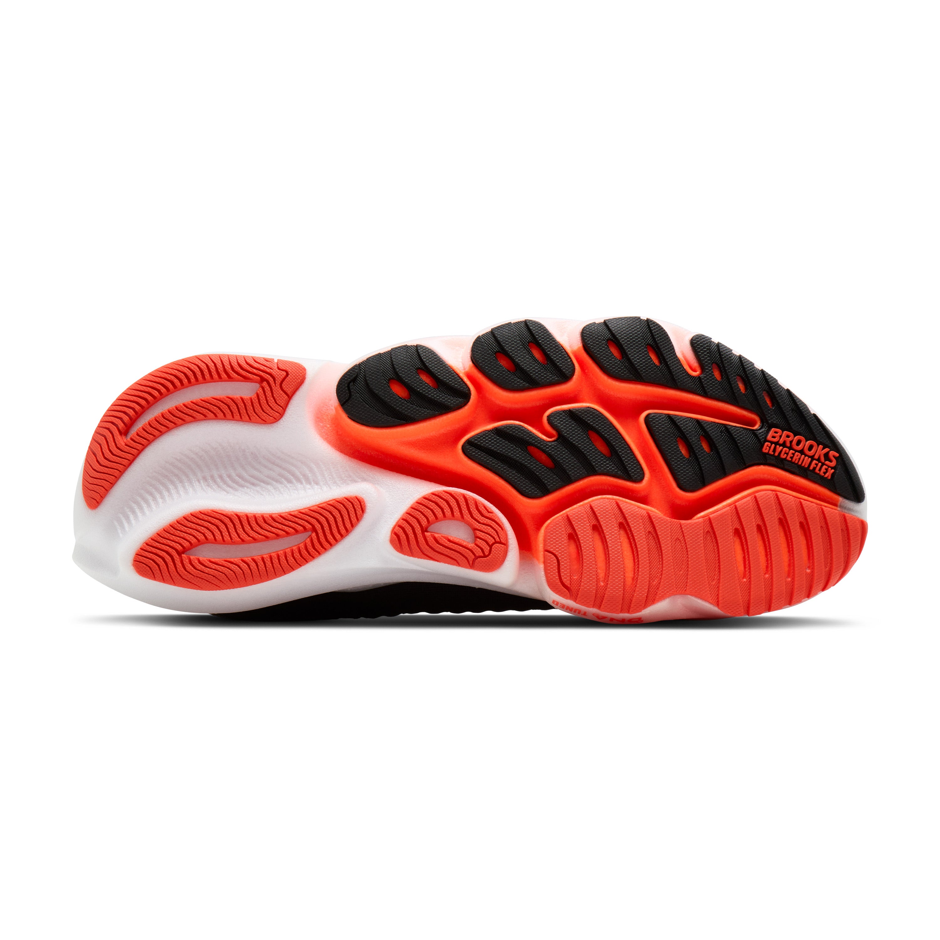 Sole of a running shoe with red and black design on a white background