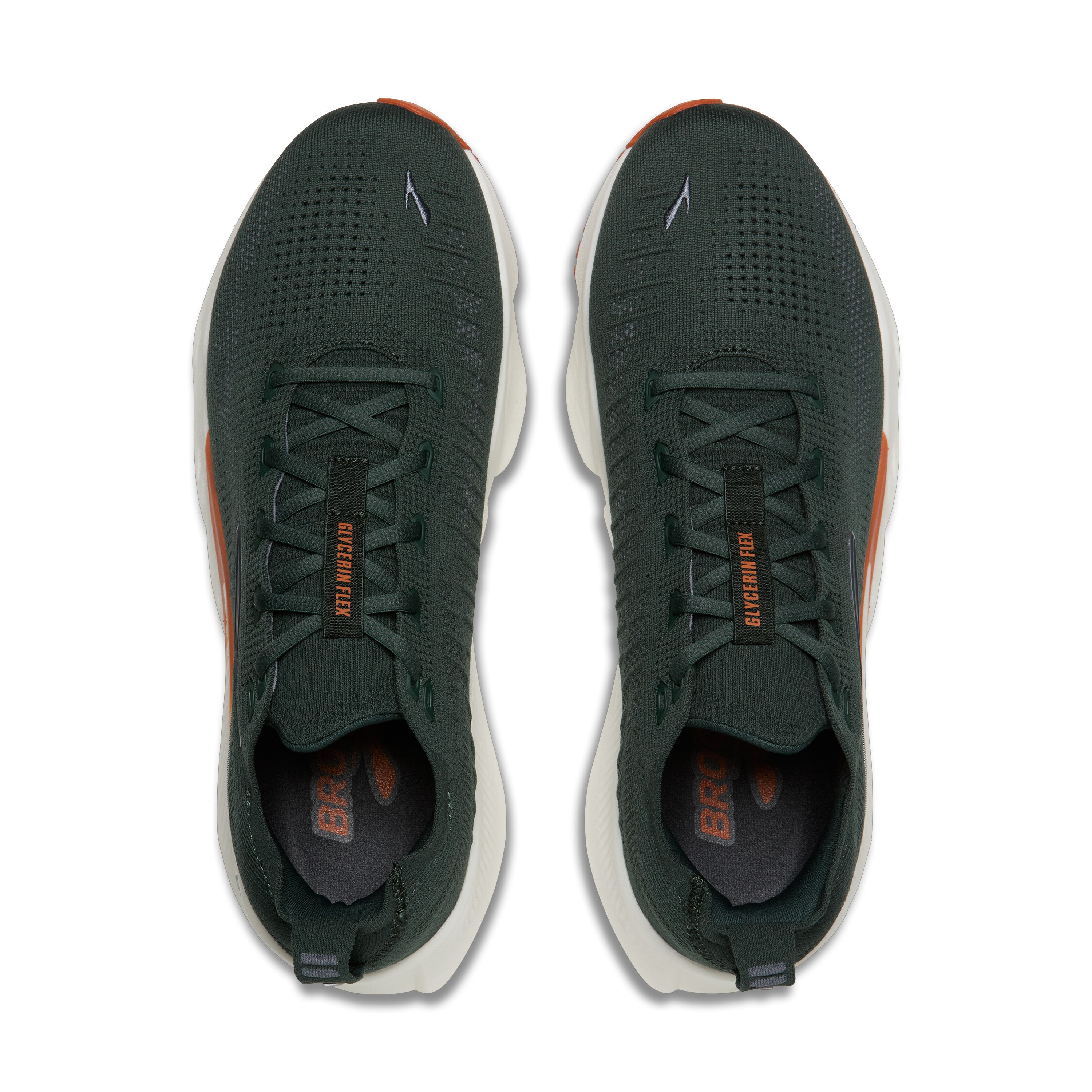 Pair of dark green athletic shoes with orange accents on a white background
