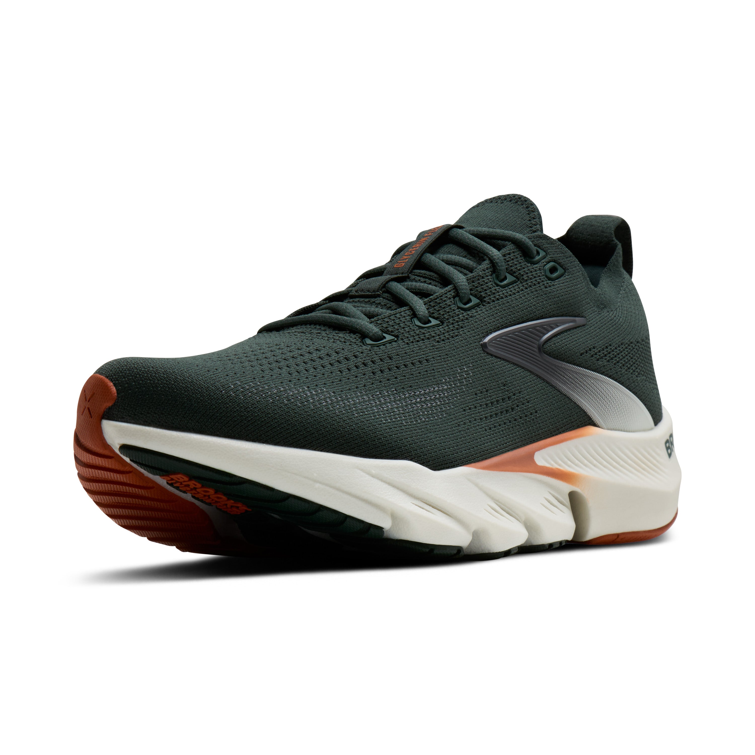 Green running shoe with white sole on a white background