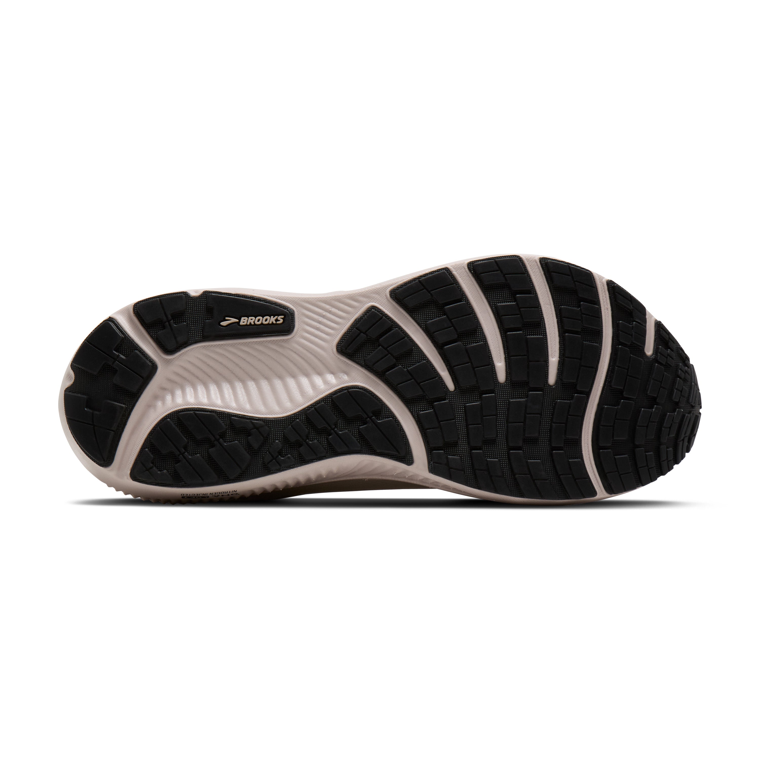 Sole of a shoe with brown and white sole design on a white background