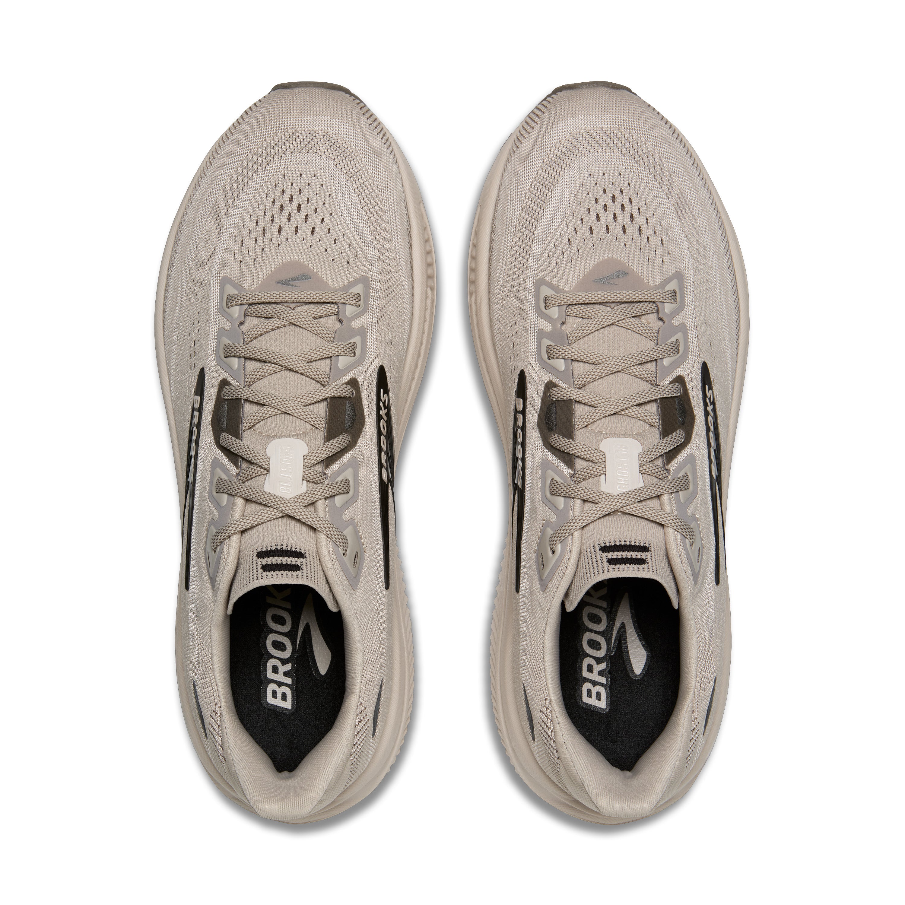 A pair of light beige running shoes shown from a top-down view on a plain white background. The shoes feature a breathable mesh upper, matching beige laces, and a black interior lining with the brand name 'BROOK' visible.