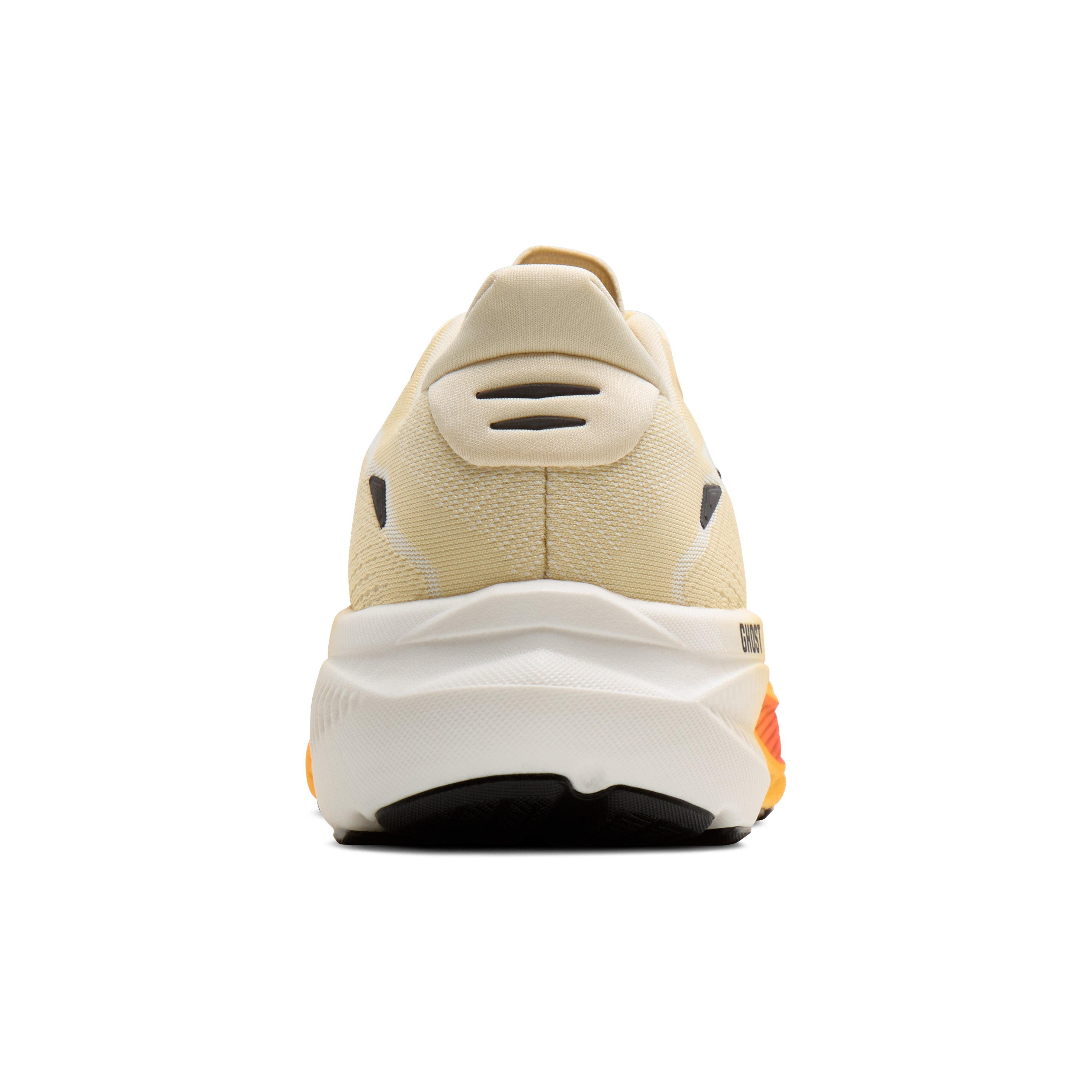 Back view of a beige sneaker with white sole on a white background